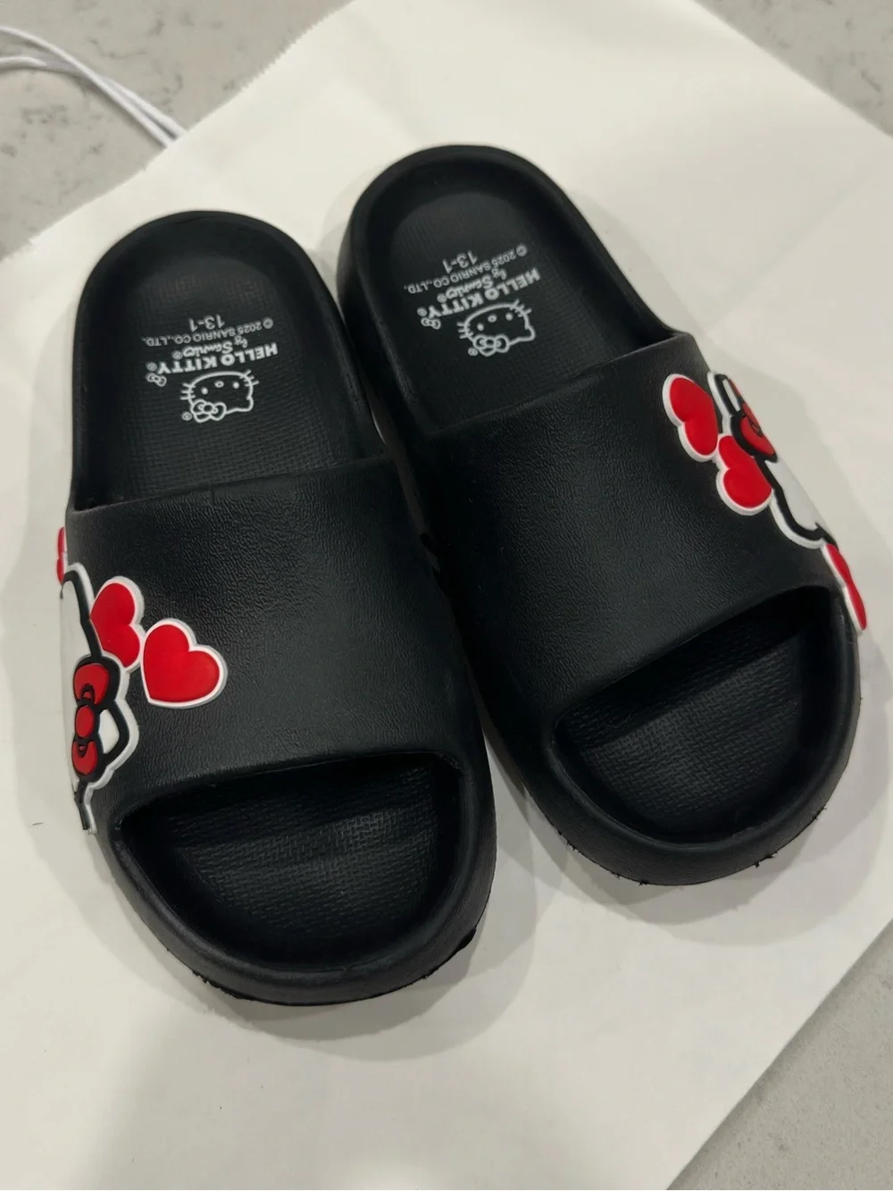 Hello Kitty Black Slide Sandals with Red Heart Accents